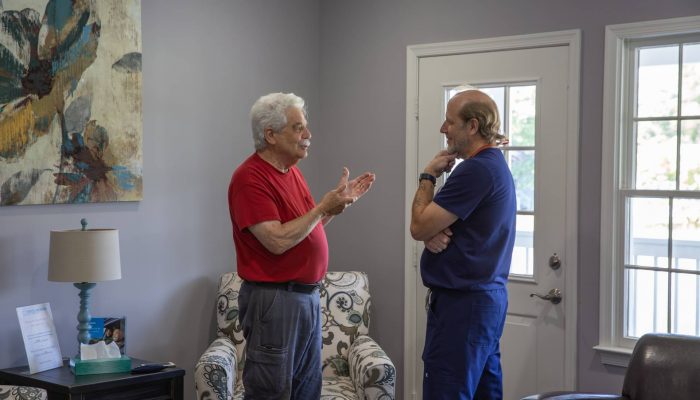 dentist is listening a patient in dental office